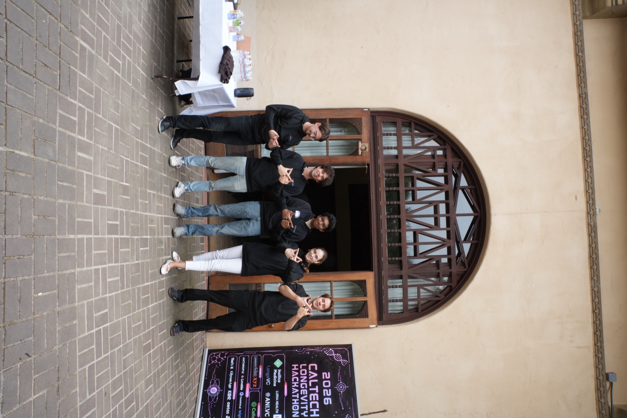 Hackathon crew group photo at the Dabney Hall entrance