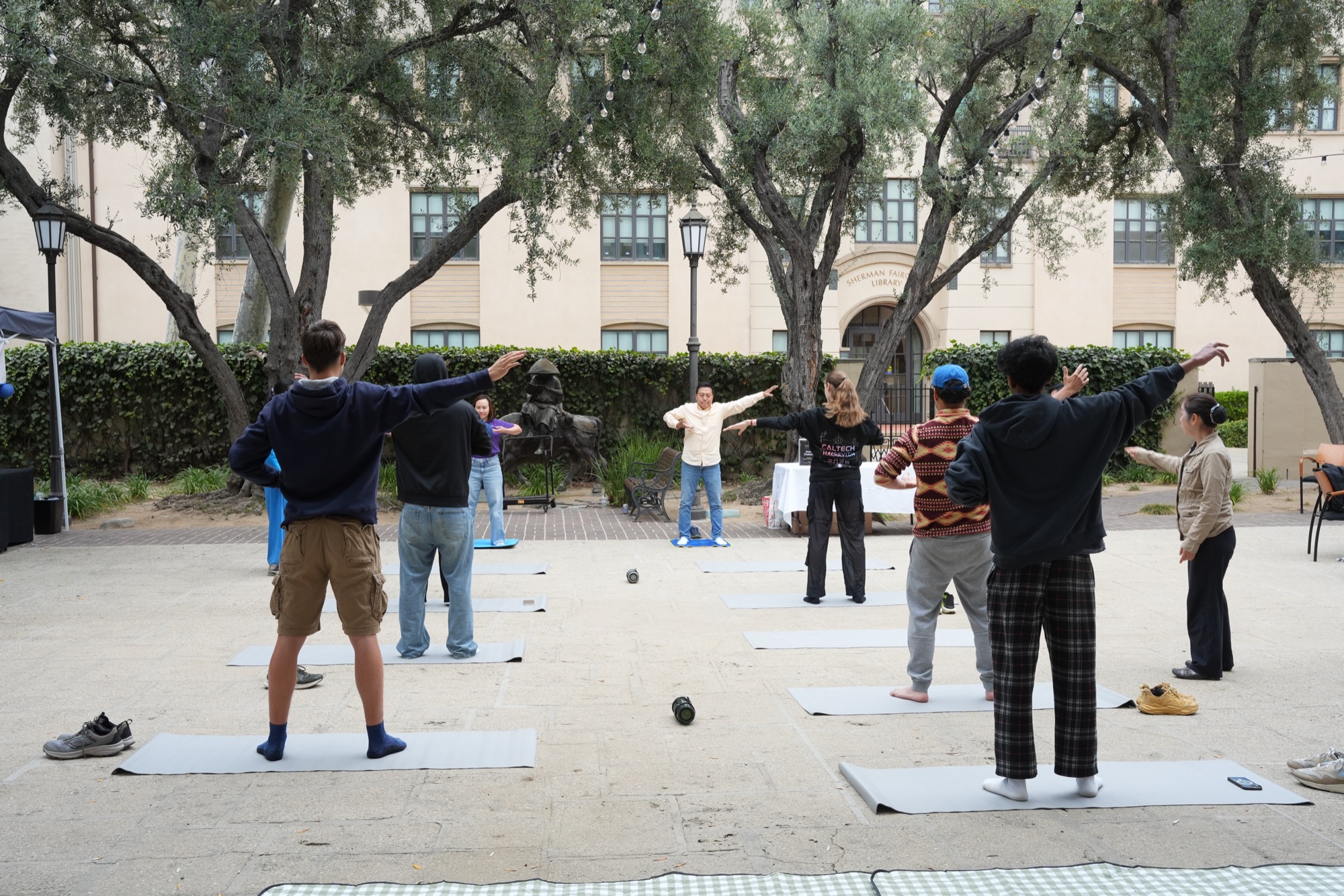 Outdoor movement session with Wen Chen in the Dabney Hall courtyard
