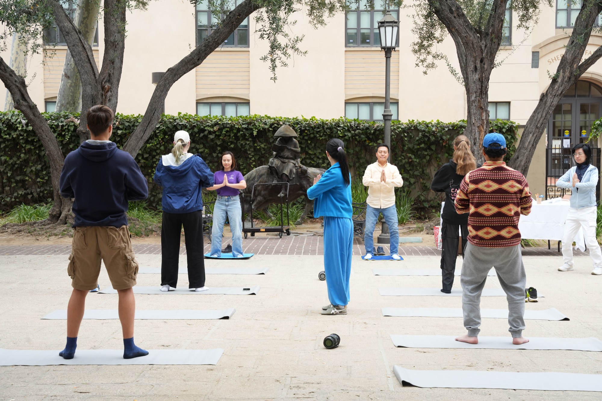 Wen Chen leading the morning movement and meditation practice