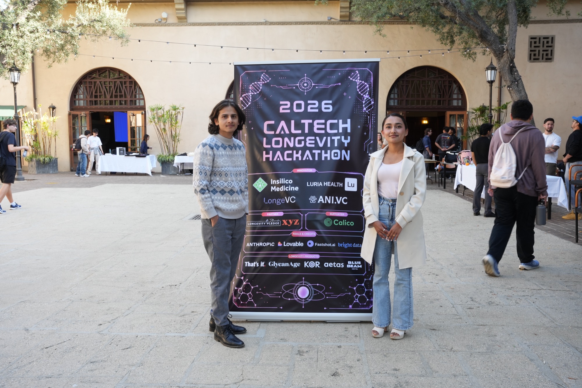 Hackathon participants at the 2026 backdrop