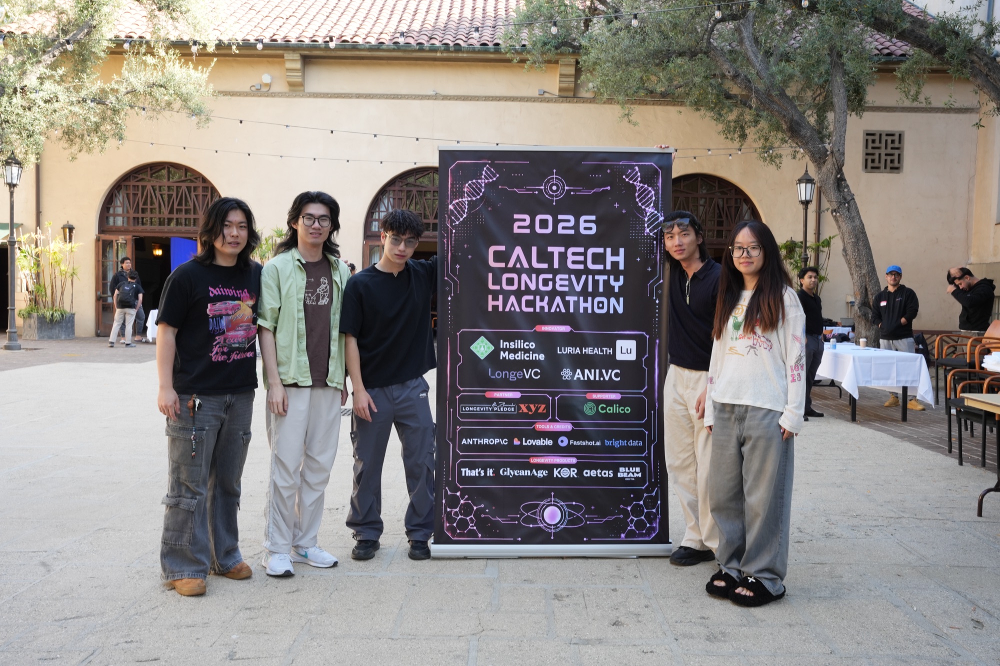 Team photo at the 2026 hackathon backdrop