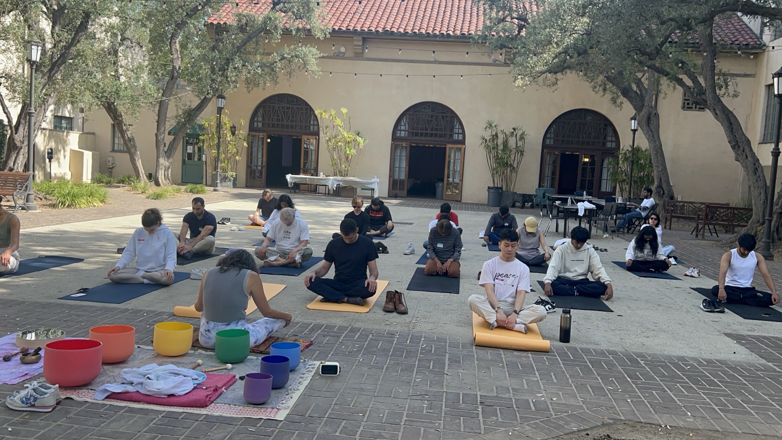 Outdoor meditation and sound bowl session on campus