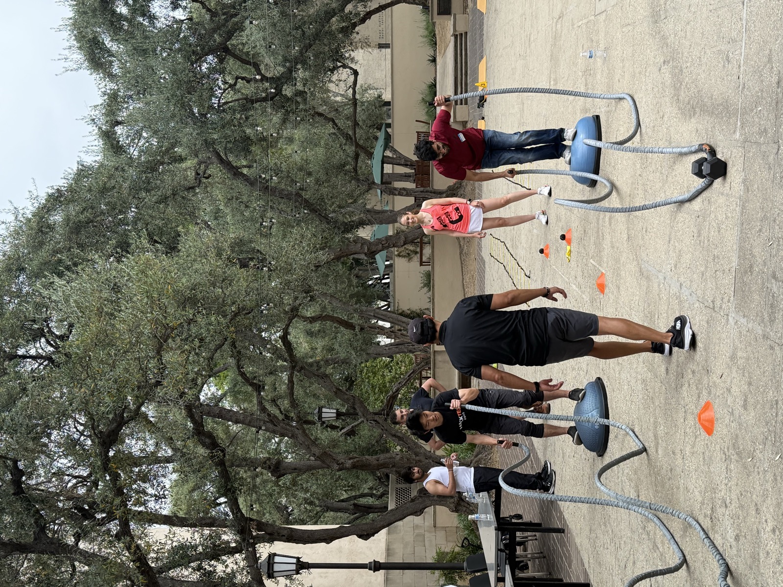 Members training outdoors on Beckman Lawn