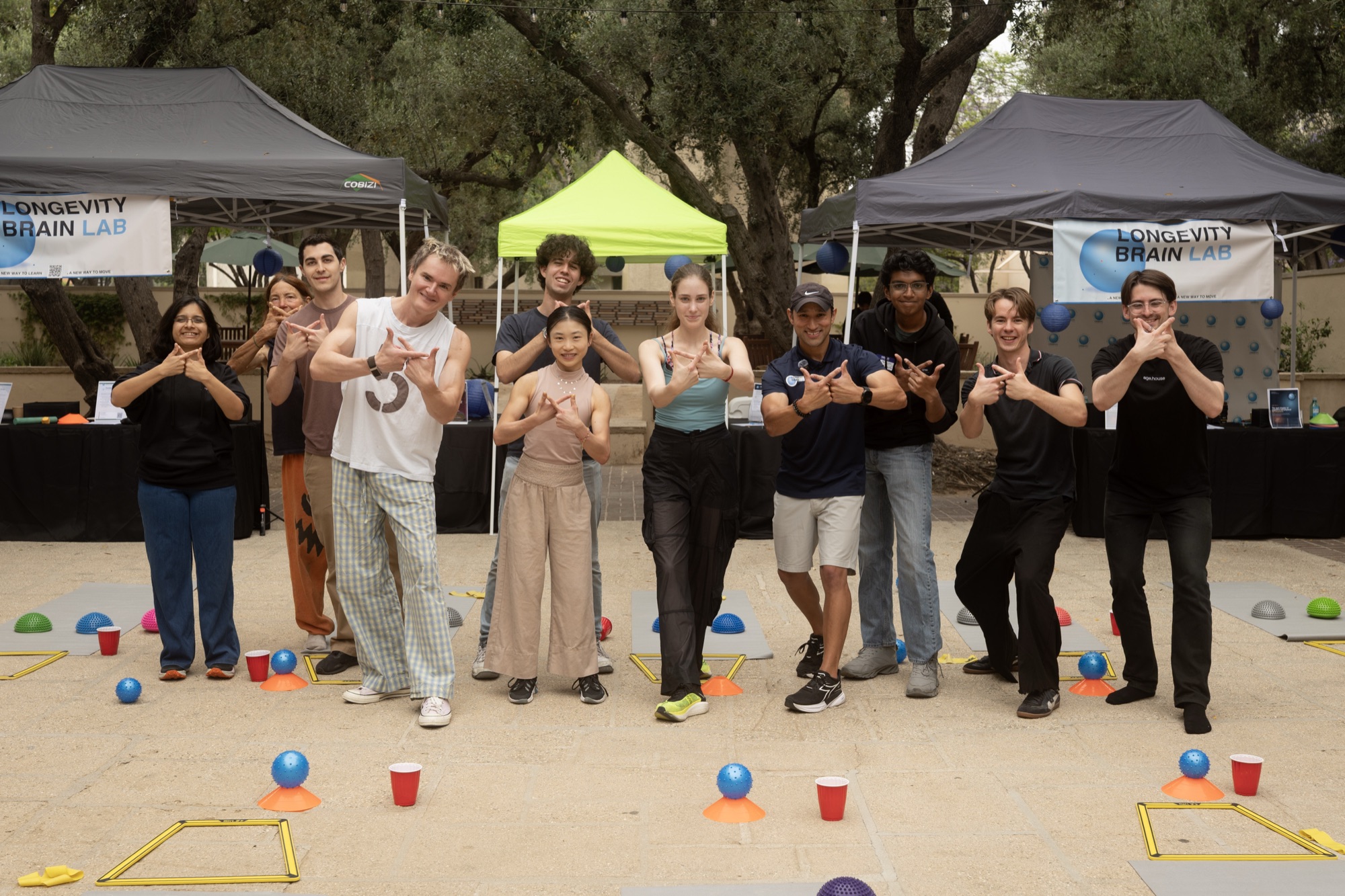 Brain Lab group photo — making brain shapes with our hands