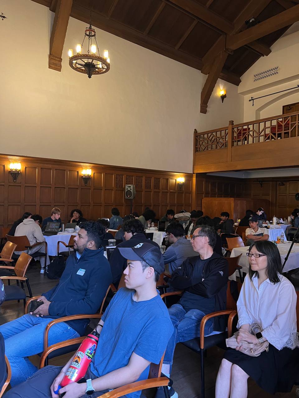 Audience engaged during a hackathon presentation